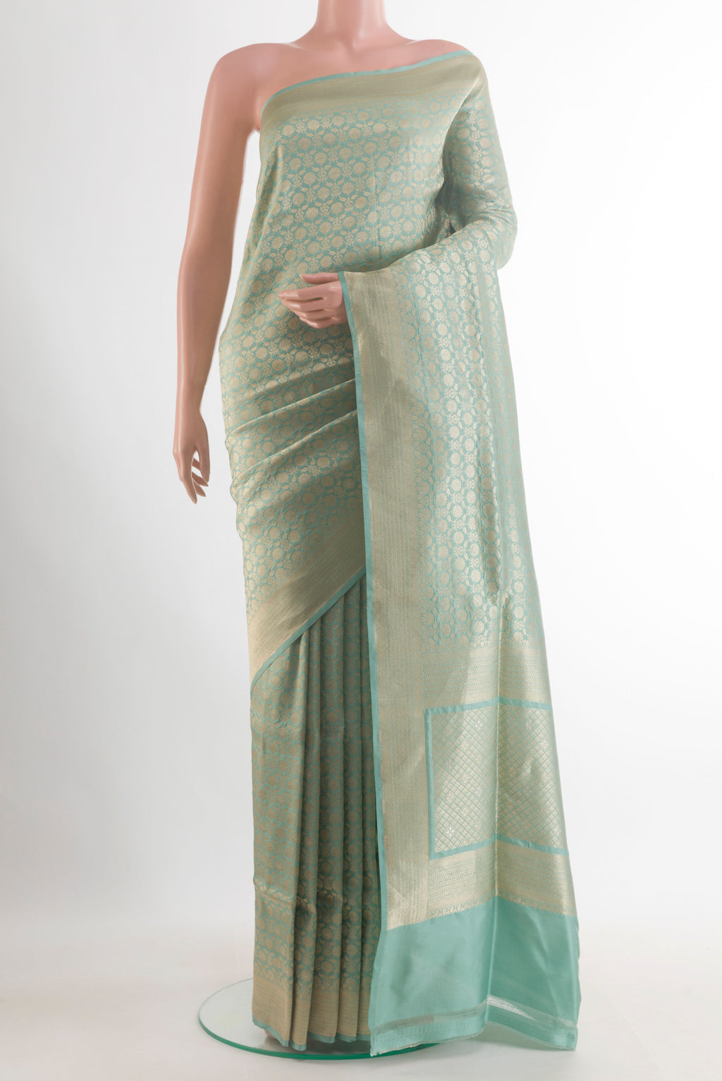 Pure Silk Sea Green Banarasi Saree with Zari Brocade on the body and Zari Border.  displayed on a mannequin