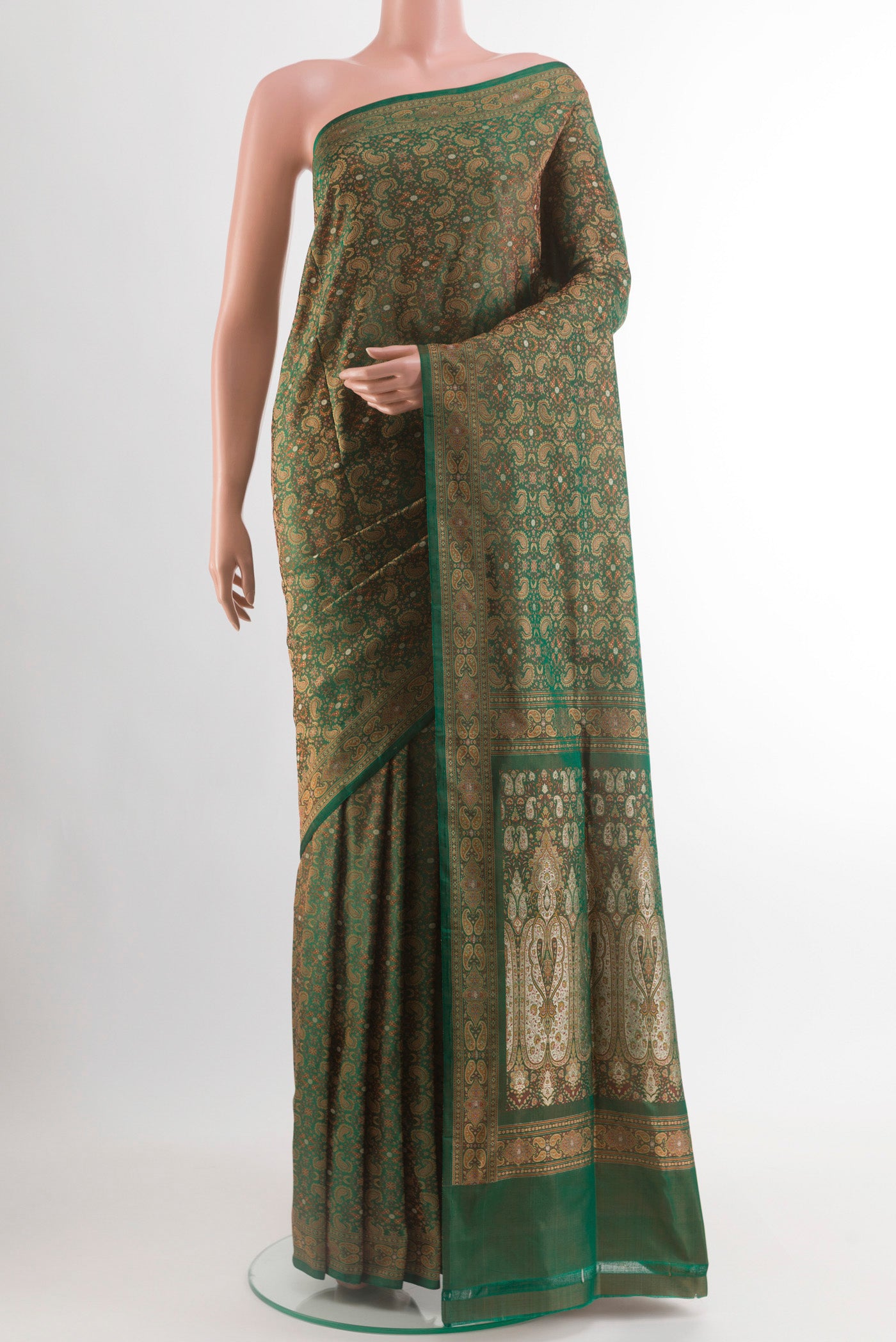 Green Banarasi Tanchoi Silk Saree with Jacquard design on the body and Zari Border.  displayed on a mannequin