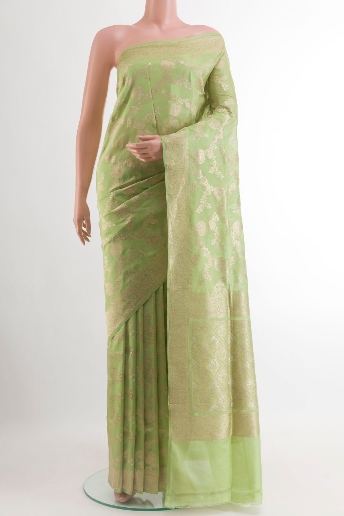 Pista Green Banarasi Silk Saree with Zari Brocade on the body and Zari Border.  displayed on a mannequin