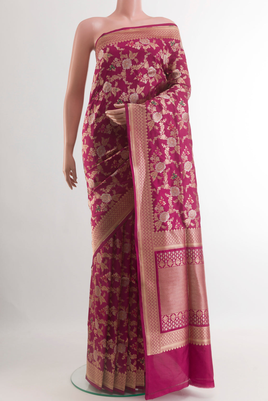 Magenta Banarasi Silk Saree with Zari Brocade on the body and Zari Border.  displayed on a mannequin