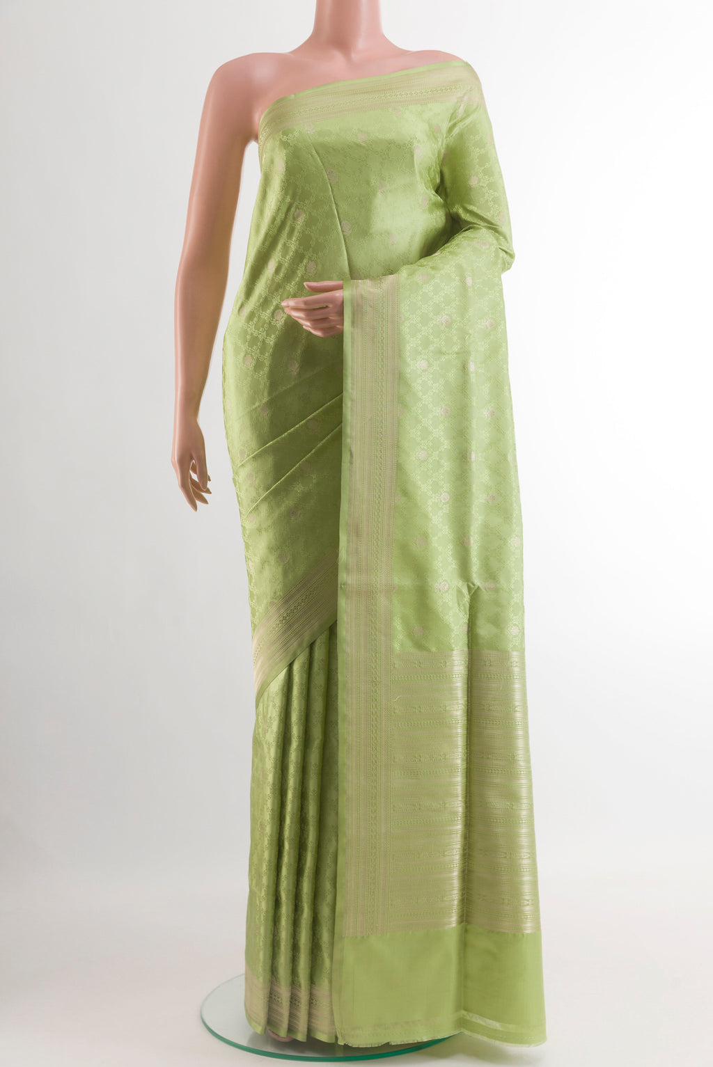 Pista Green Banarasi Silk Saree with Jacquard With Zari Butta on the body and Zari Border.  displayed on a mannequin