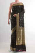 Black Banarasi Silk Saree with Jacquard With Zari Butta on the body and Zari Border.  displayed on a mannequin