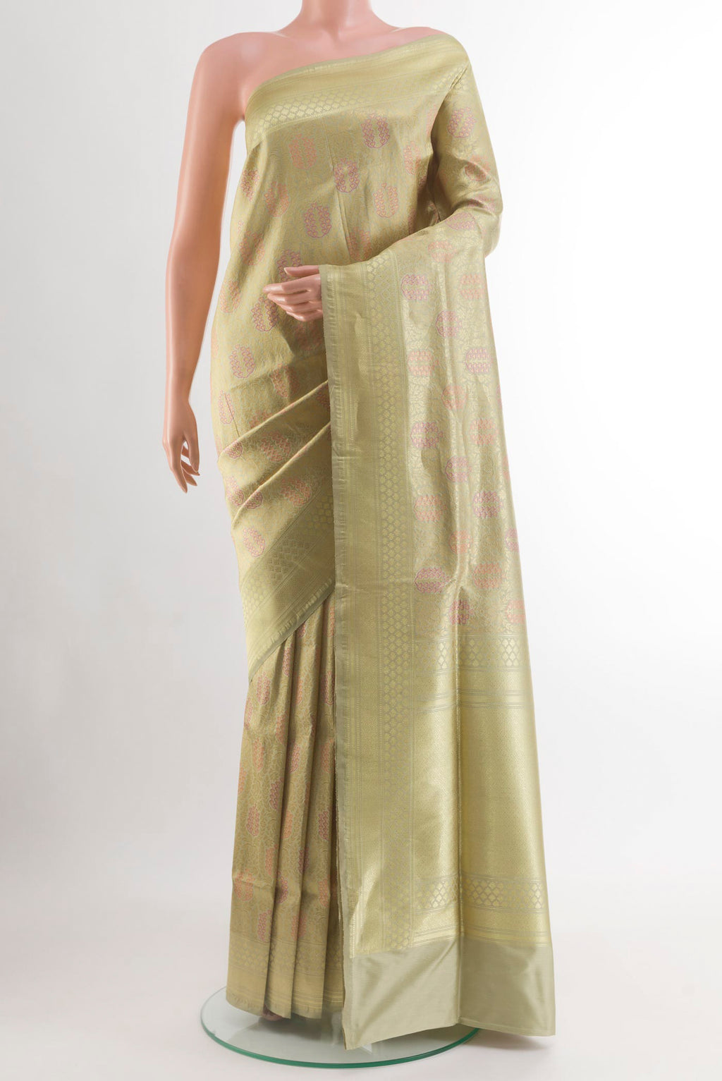 Beige Banarasi Silk Saree with Zari Brocade on the body and Zari Border.  displayed on a mannequin