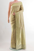 Beige Banarasi Silk Saree with Zari Brocade on the body and Zari Border.  displayed on a mannequin