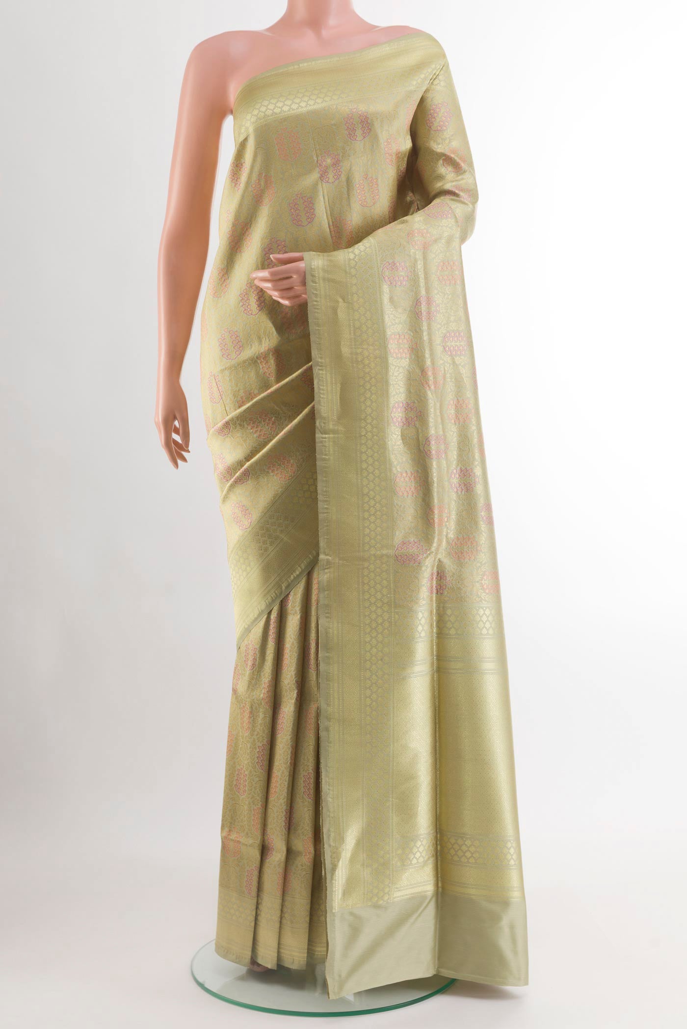 Beige Banarasi Silk Saree with Zari Brocade on the body and Zari Border.  displayed on a mannequin