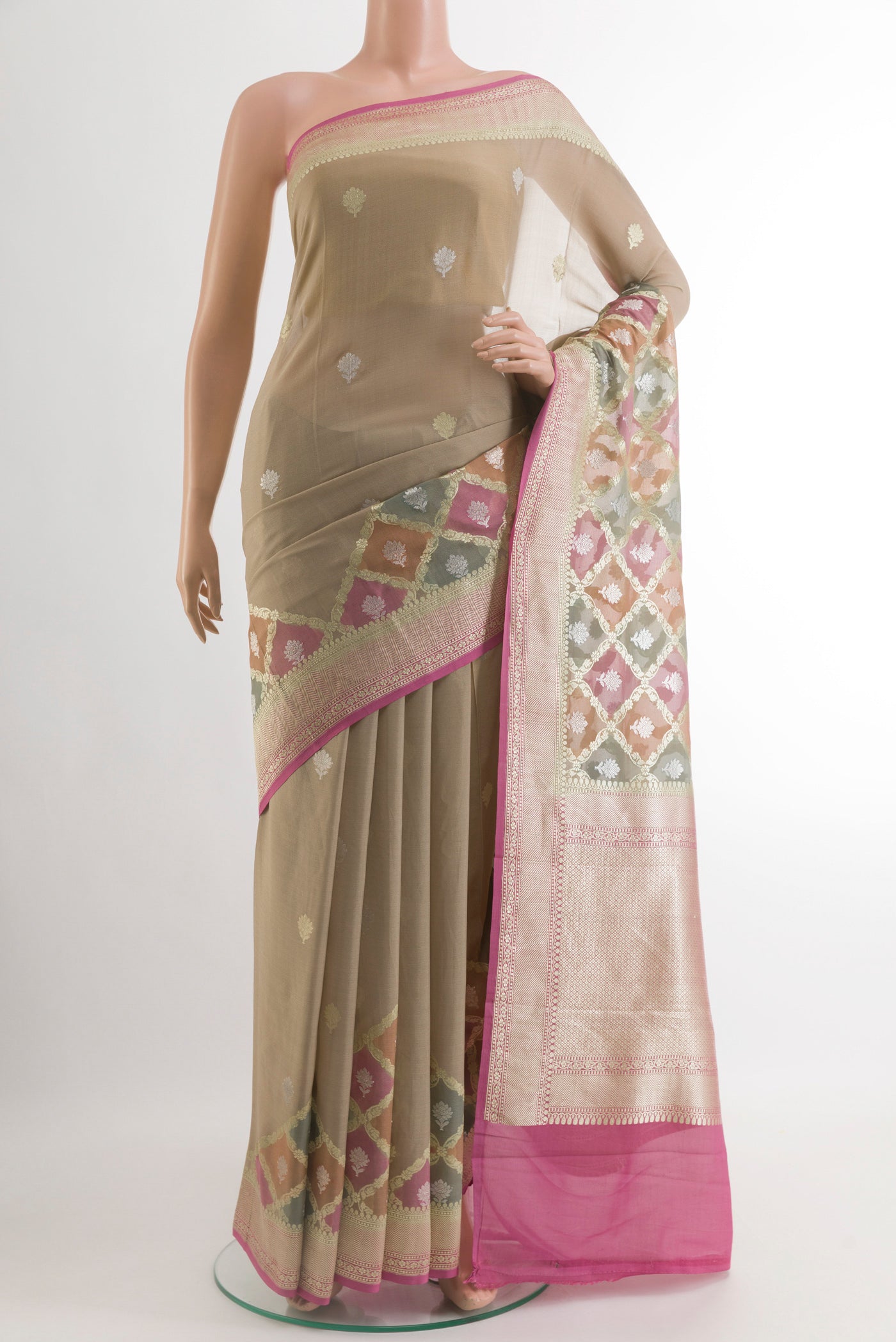 Beige Banarasi Georgette Saree with Zari Butta on the body and Zari Border.  displayed on a mannequin