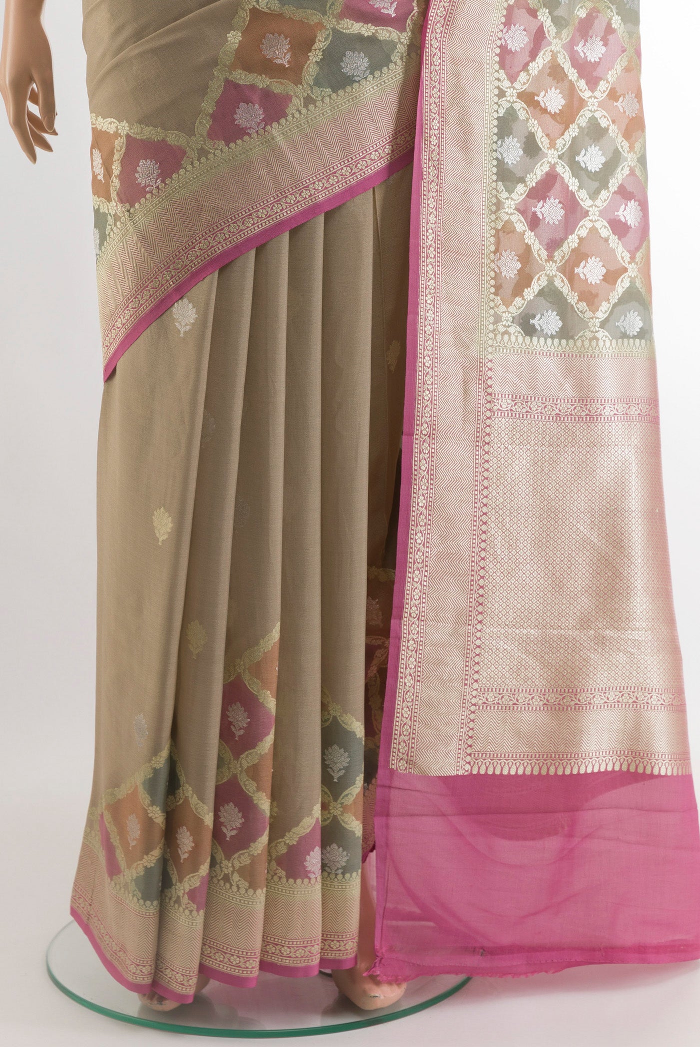 Pleats and pallu of Beige Banarasi Georgette Saree with Zari Butta on the body and Zari Border. 