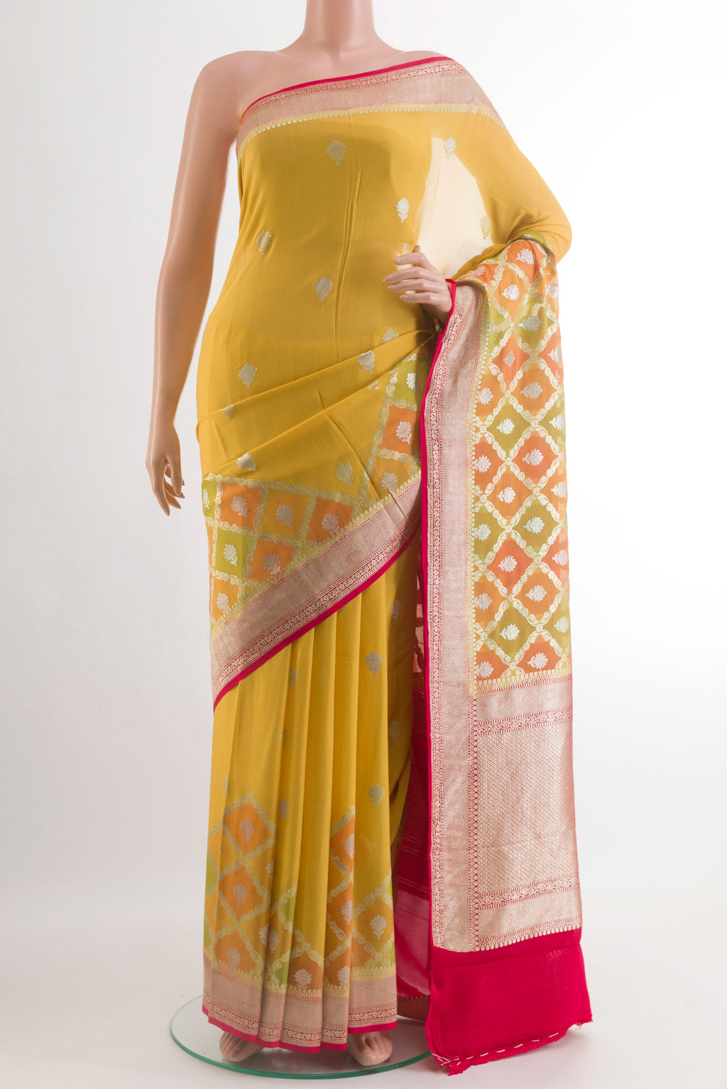Yellow Banarasi Georgette Saree with Zari Butta on the body and Zari Border.  displayed on a mannequin