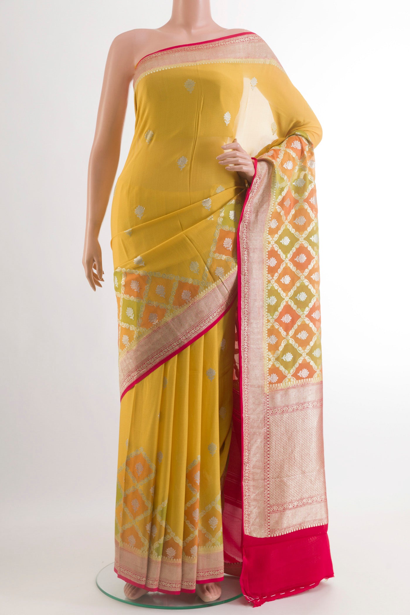 Yellow Banarasi Georgette Saree with Zari Butta on the body and Zari Border.  displayed on a mannequin