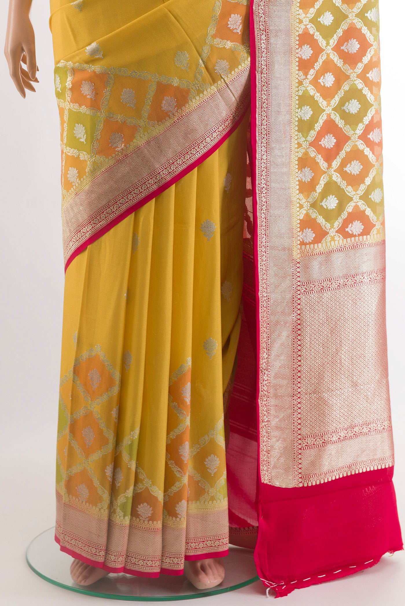 Pleats and pallu of Yellow Banarasi Georgette Saree with Zari Butta on the body and Zari Border. 