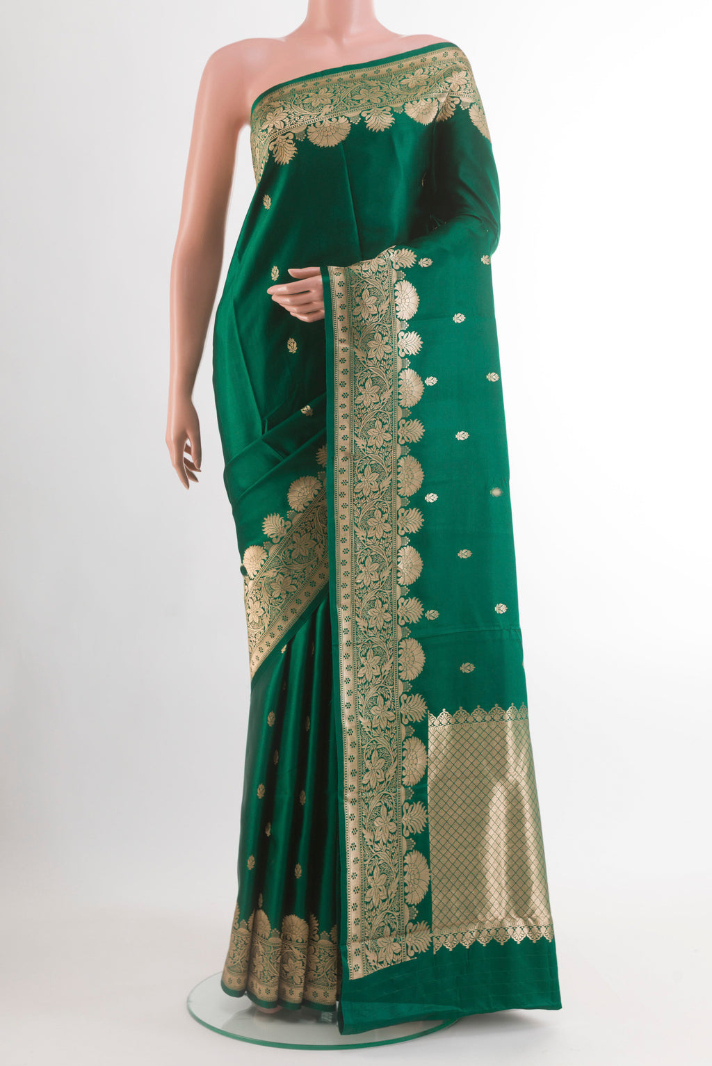 Bottle Green Banarasi Silk Saree with Zari Butta on the body and Zari Border.  displayed on a mannequin