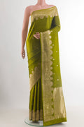 Mehandi Green Banarasi Katan Silk Saree with Zari Butta on the body and Zari Border.  displayed on a mannequin