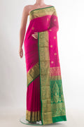 Pure Silk Pink Kanjivaram Saree with Zari Butta on the body and Zari Border.  displayed on a mannequin