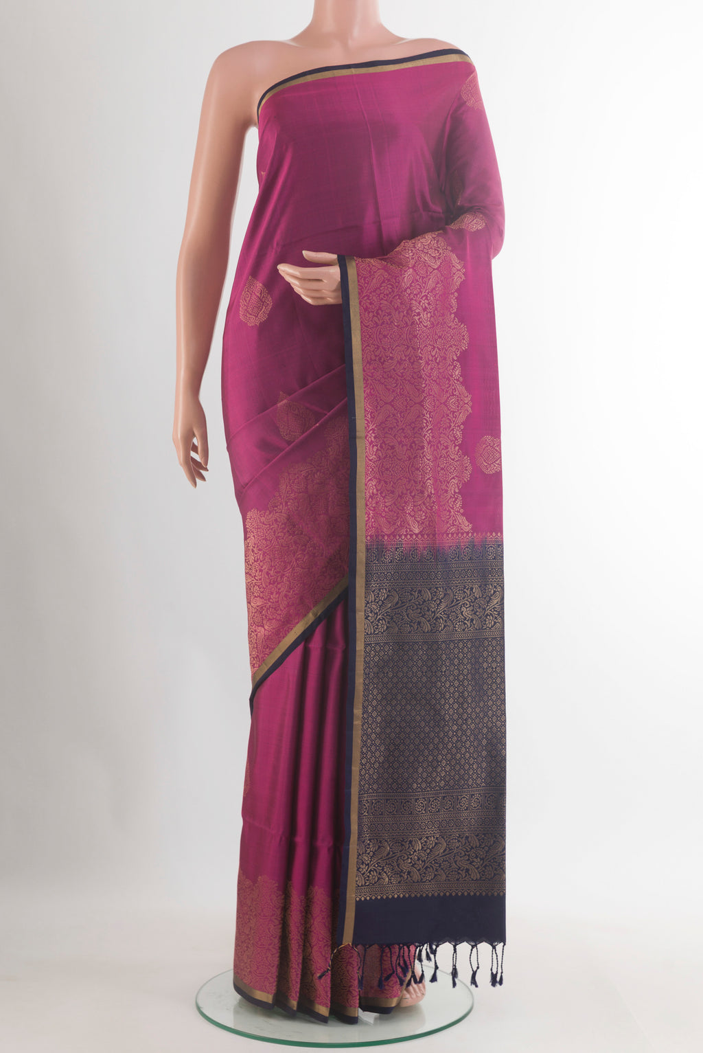 Pure Silk Light Magenta Soft Saree with Zari Butta on the body and Zari Border.  displayed on a mannequin