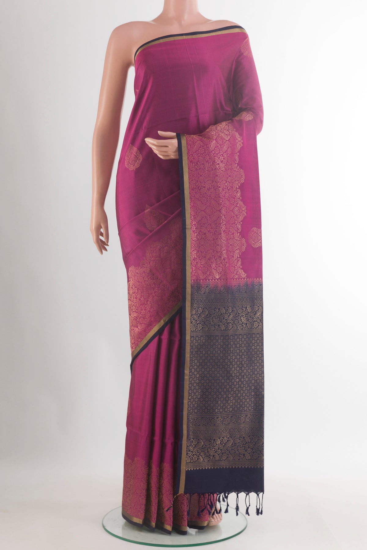 Pure Silk Light Magenta Soft Saree with Zari Butta on the body and Zari Border.  displayed on a mannequin