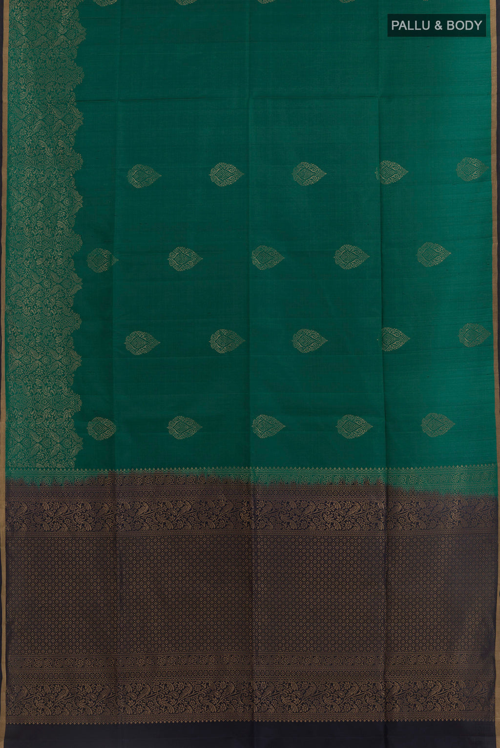 Flat view of Teal Soft Silk Saree with Zari Butta on the body and Zari Border. 