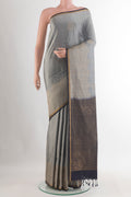 Pure Silk Grey Soft Saree with Zari Butta on the body and Zari Border.  displayed on a mannequin