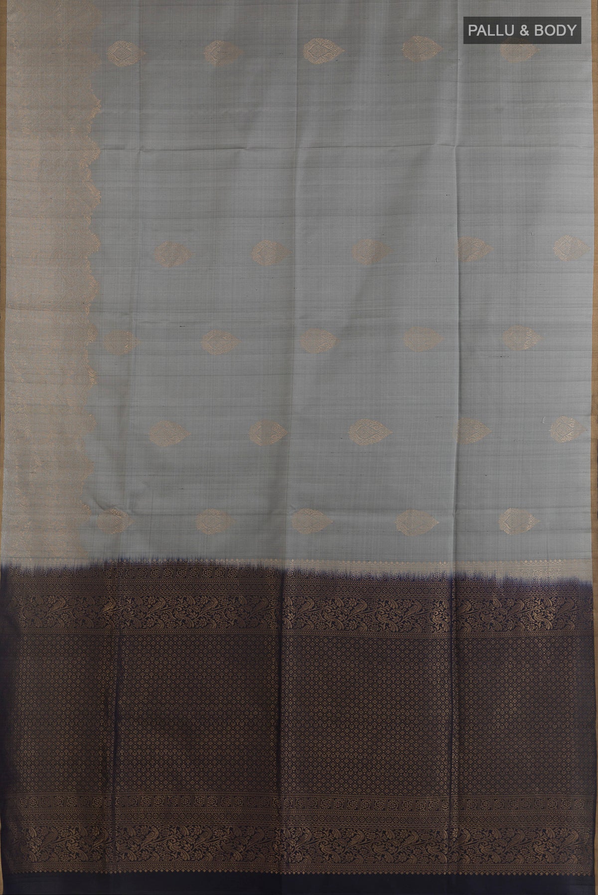 Flat view of Pure Silk Grey Soft Saree with Zari Butta on the body and Zari Border. 