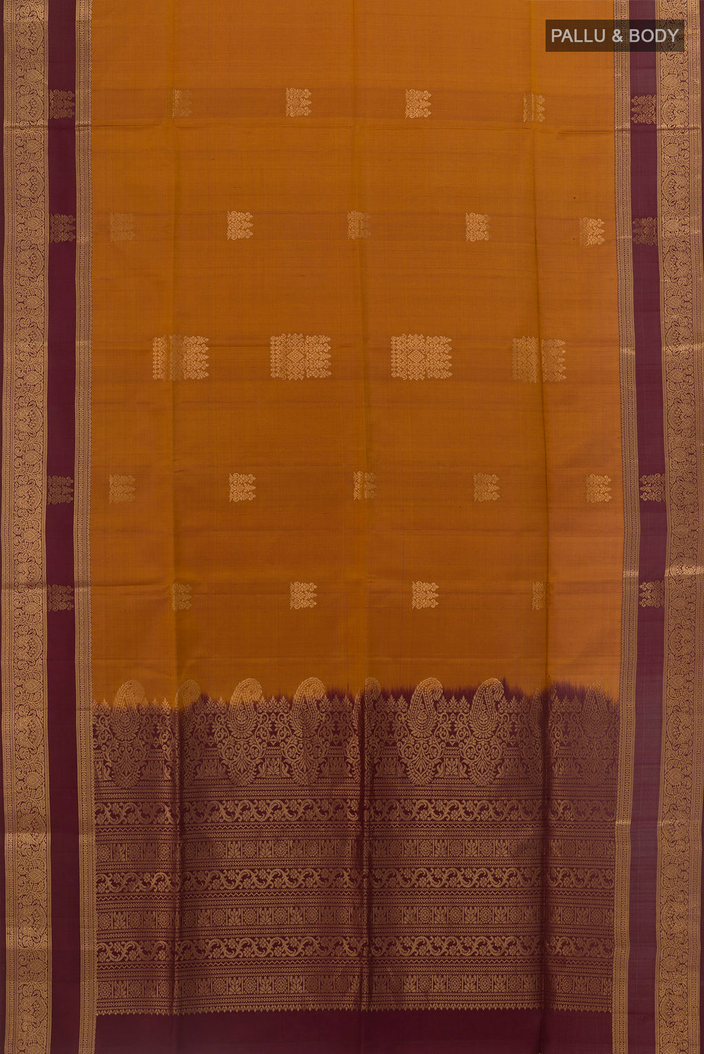 Flat view of Mustard Soft Silk Saree with Zari Butta on the body and Zari Border. 