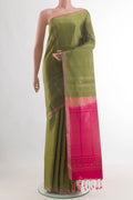Mehandi Green Soft Silk Saree with Zari Butta on the body and Zari Border.  displayed on a mannequin