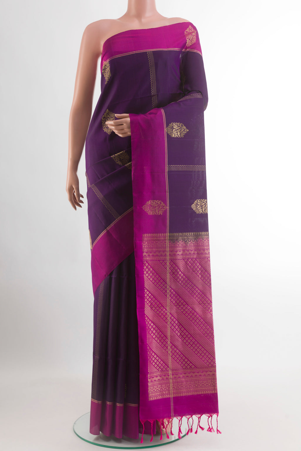 Violet Soft Silk Saree with Zari Butta on the body and Zari Border.  displayed on a mannequin
