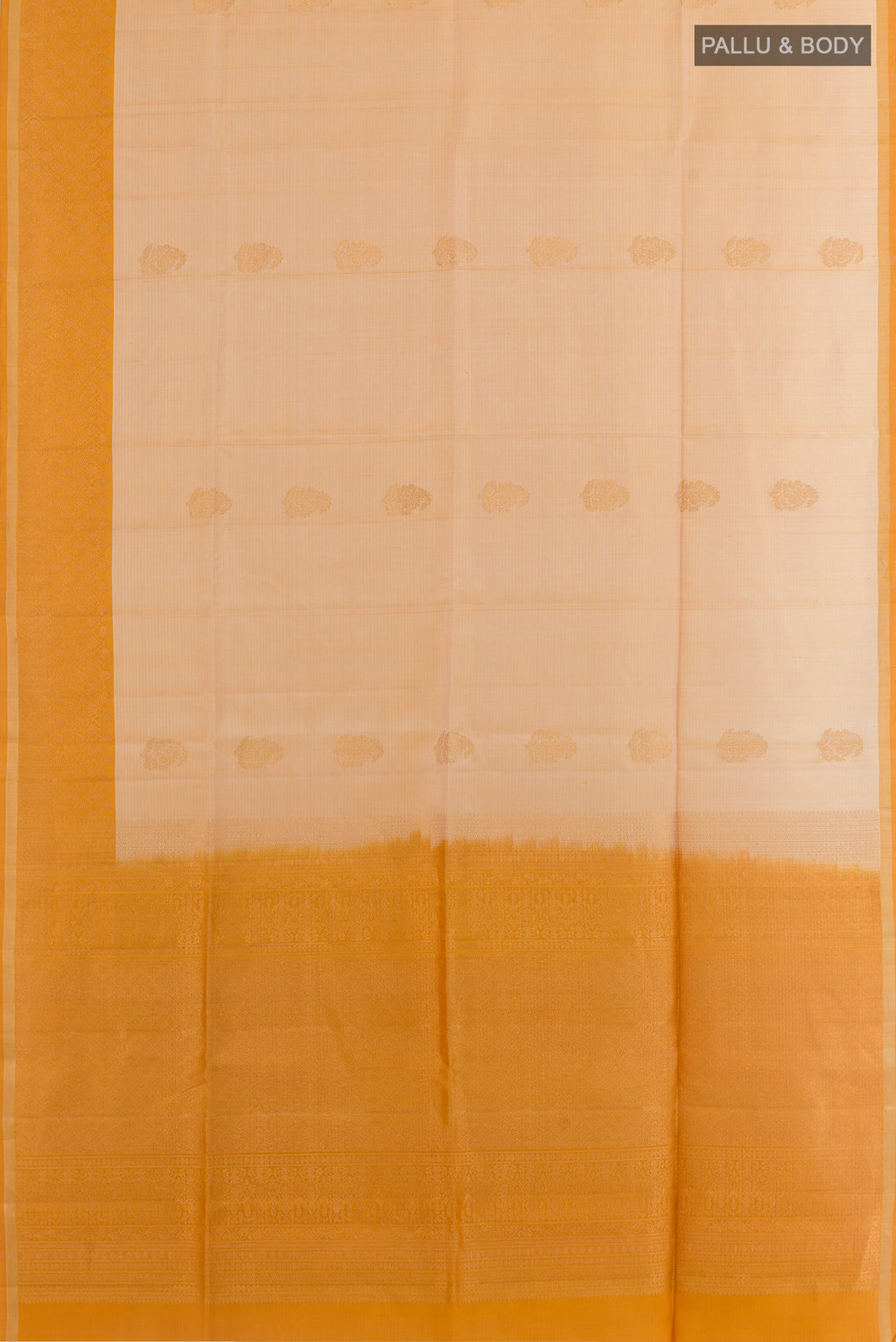 Flat view of Beige Soft Silk Saree with Zari Butta on the body and Zari Border. 