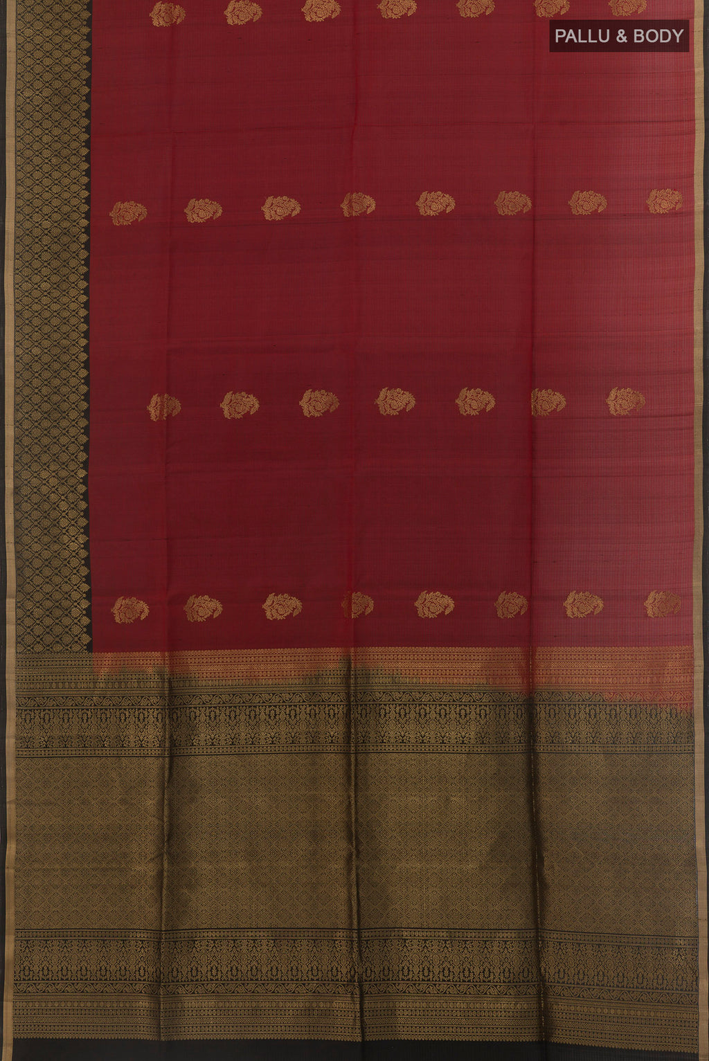 Flat view of Maroon Soft Silk Saree with Zari Butta on the body and Zari Border. 