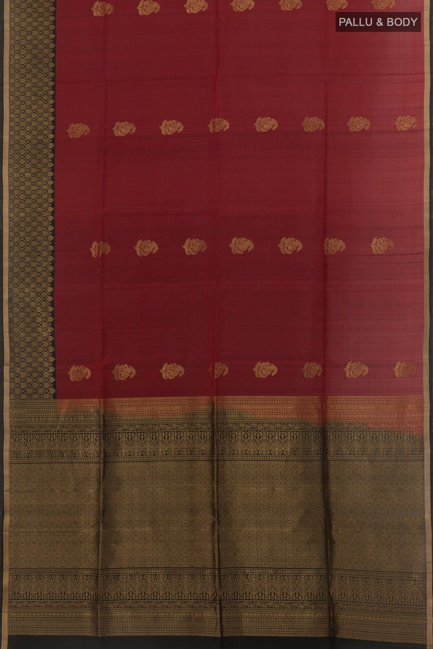 Flat view of Maroon Soft Silk Saree with Zari Butta on the body and Zari Border. 