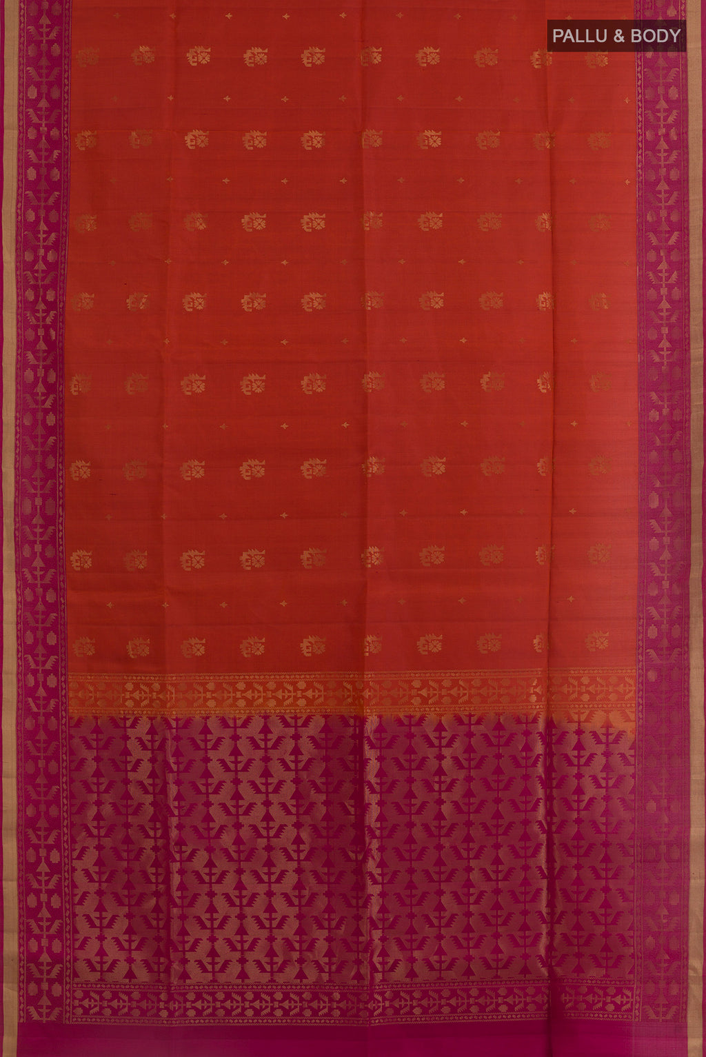 Flat view of Brick Orange Soft Silk Saree with Zari Butta on the body and Zari Border. 