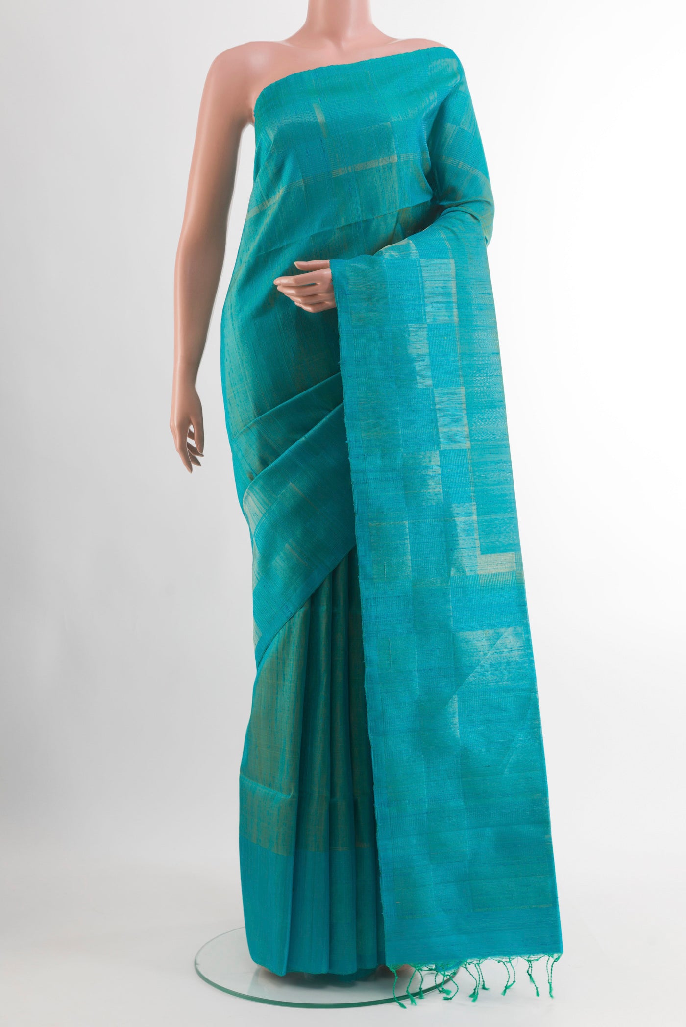 Blue Soft Silk Saree with Plain Body and Plain Border.  displayed on a mannequin