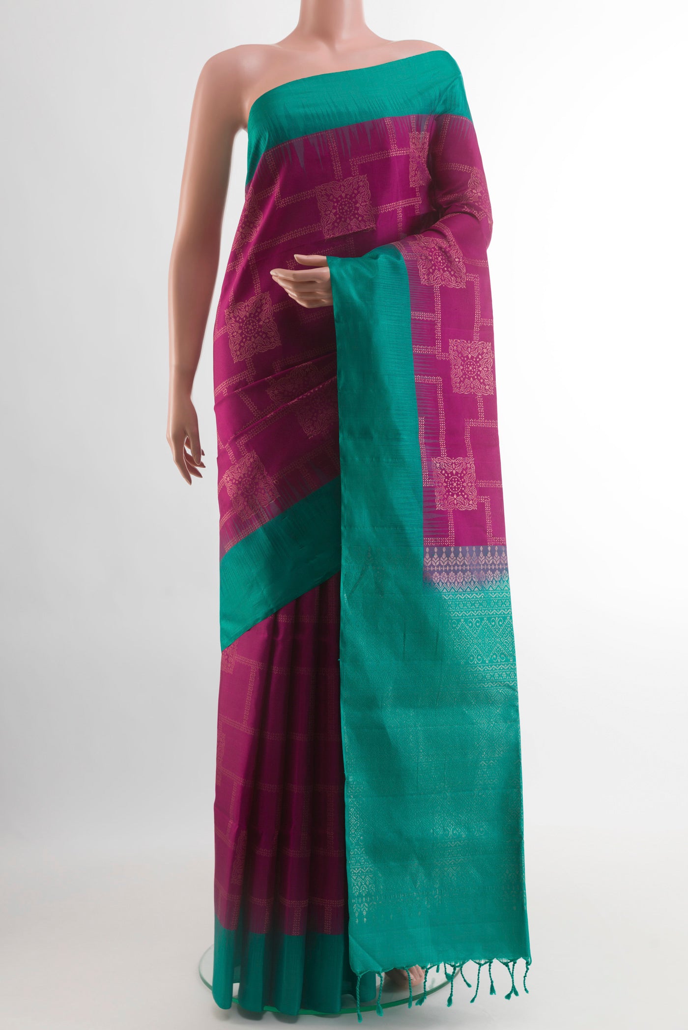 Magenta Soft Silk Saree with Zari Butta on the body and Zari Border.  displayed on a mannequin