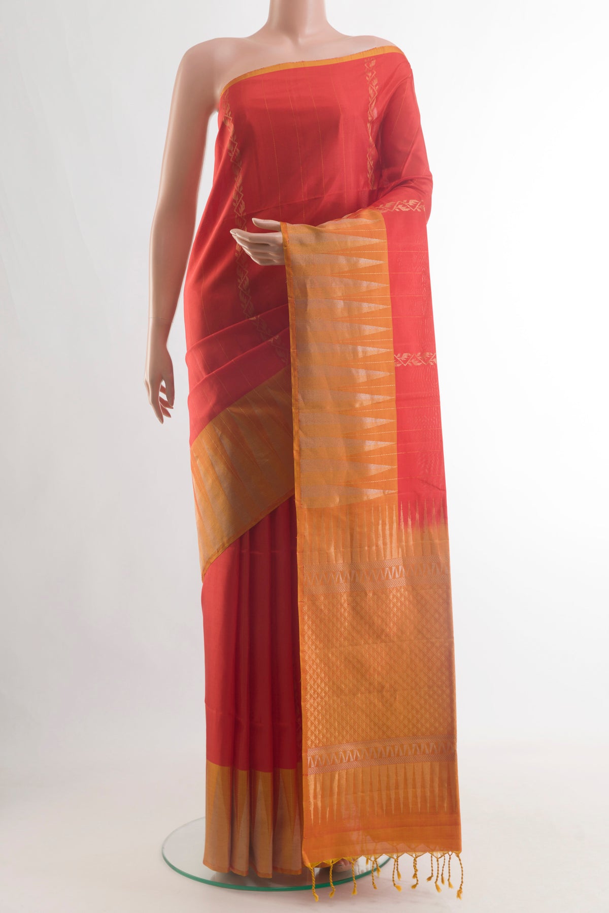 Red Soft Silk Saree with Zari Butta on the body and Fancy Border.  displayed on a mannequin