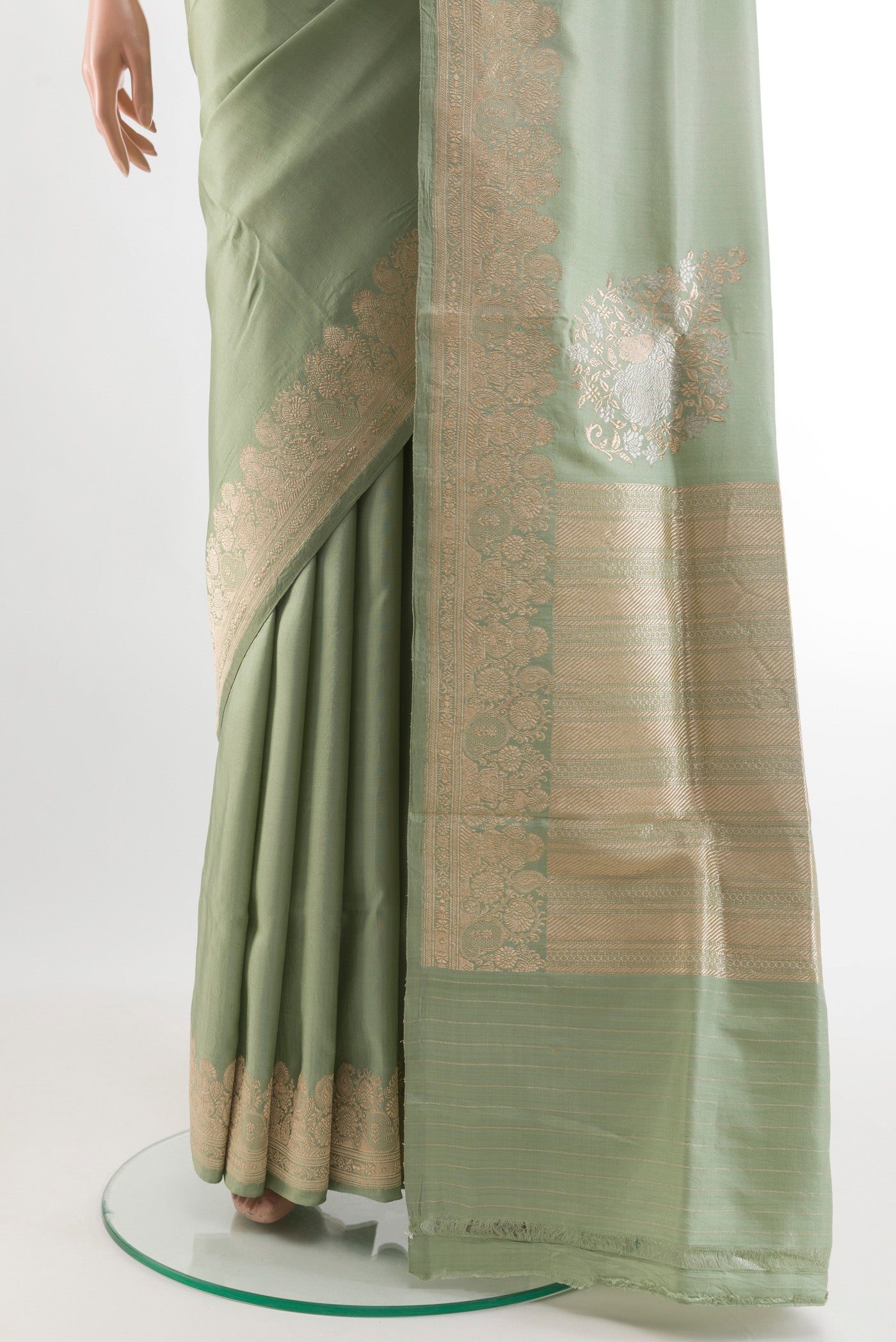Pleats and pallu of Sage Green Banarasi Silk Saree with Plain Body and Zari Border. 