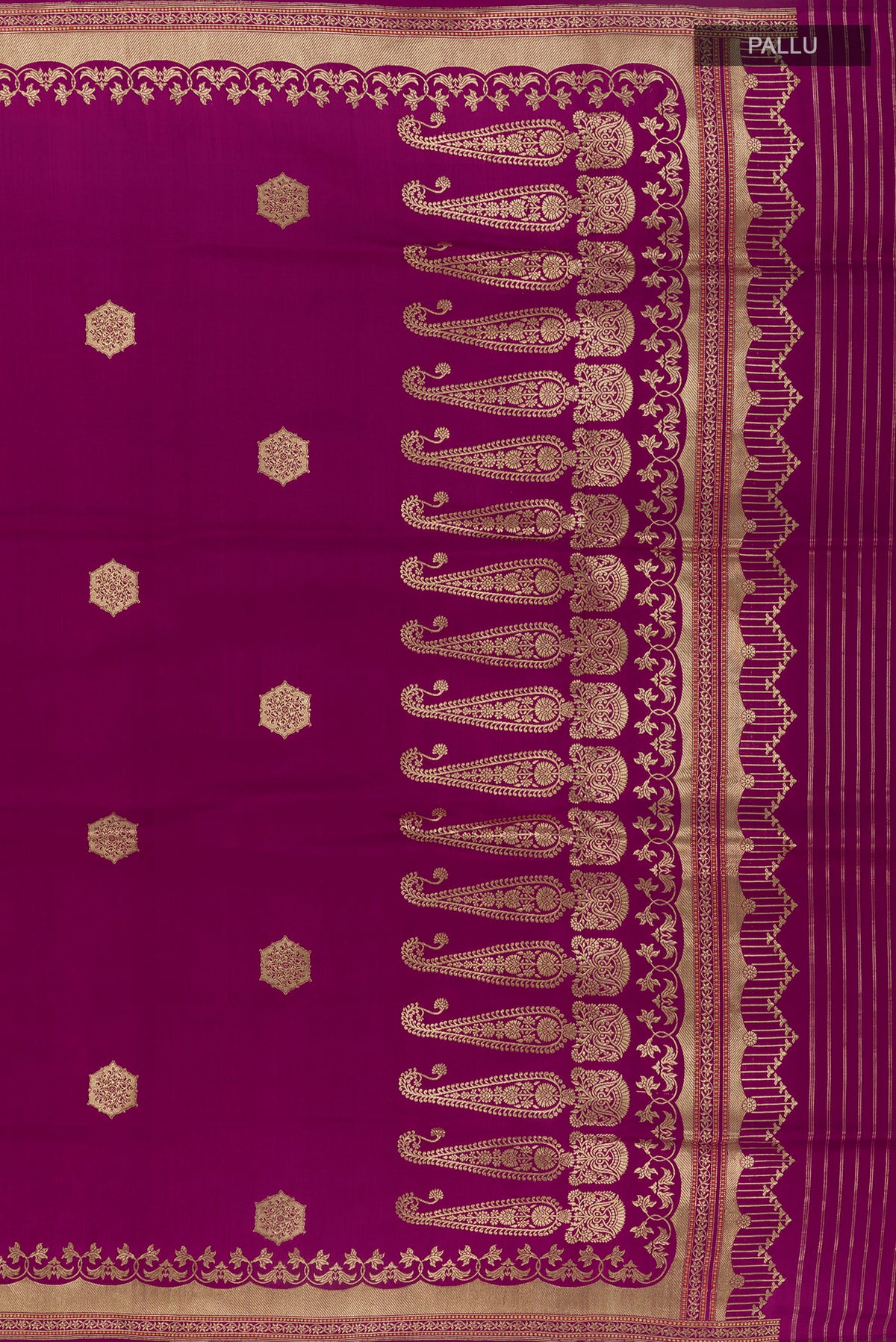 Close up image of the pallu of Pure Silk Magenta Banarasi Saree with Zari Butta on the body and Zari Border. 