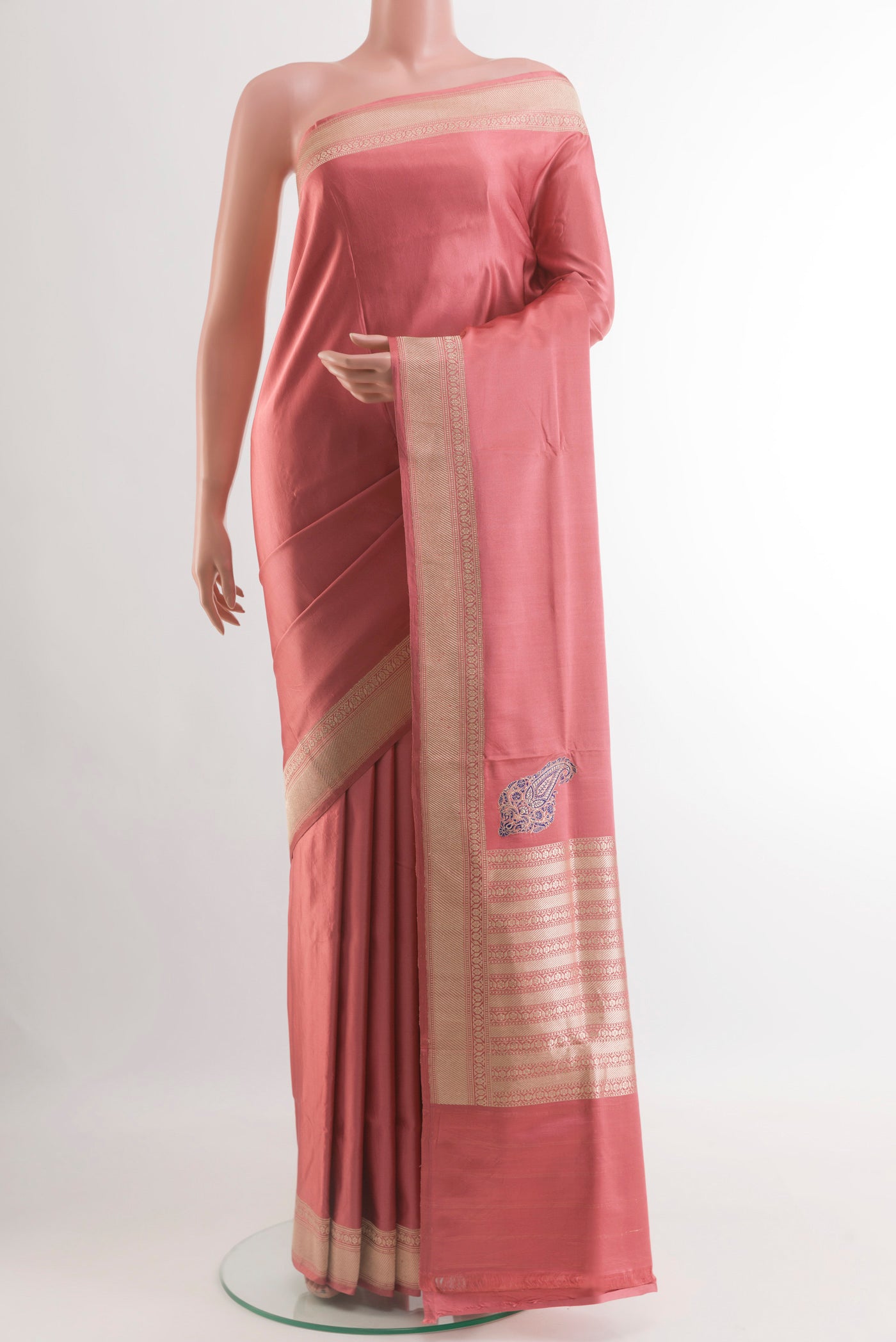 Coral Banarasi Silk Saree with Plain Body and Zari Border.  displayed on a mannequin