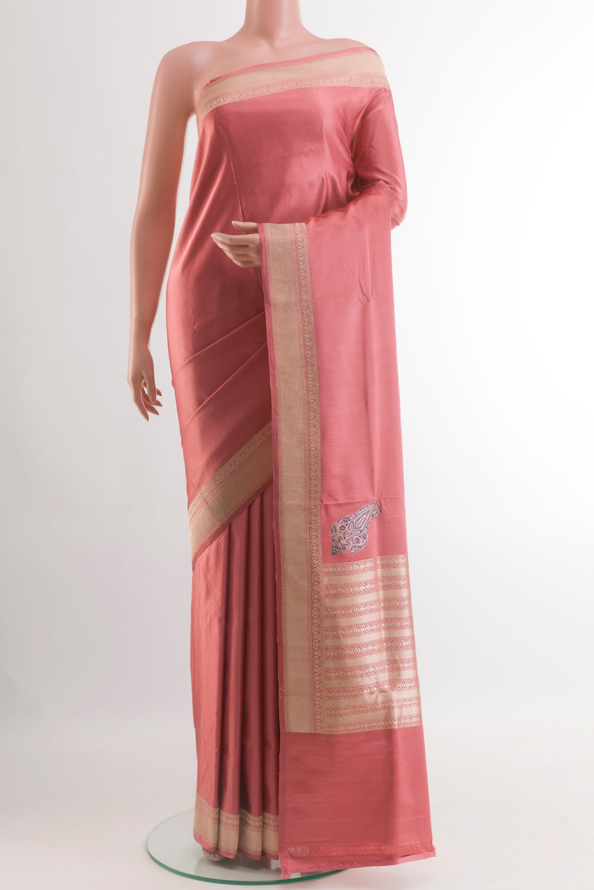 Coral Banarasi Silk Saree with Plain Body and Zari Border.  displayed on a mannequin