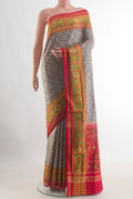 Grey Rajkot Patola Silk Saree with Pure Ikat on the body and Ikat Border.  displayed on a mannequin