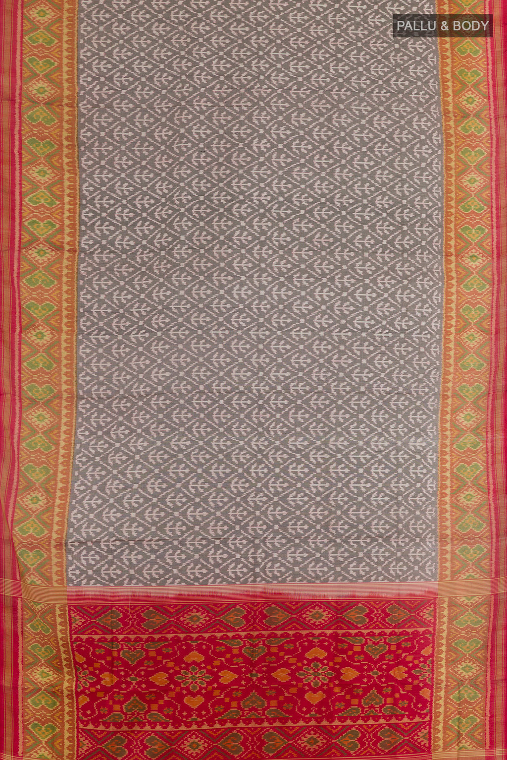 Flat view of Grey Rajkot Patola Silk Saree with Pure Ikat on the body and Ikat Border. 
