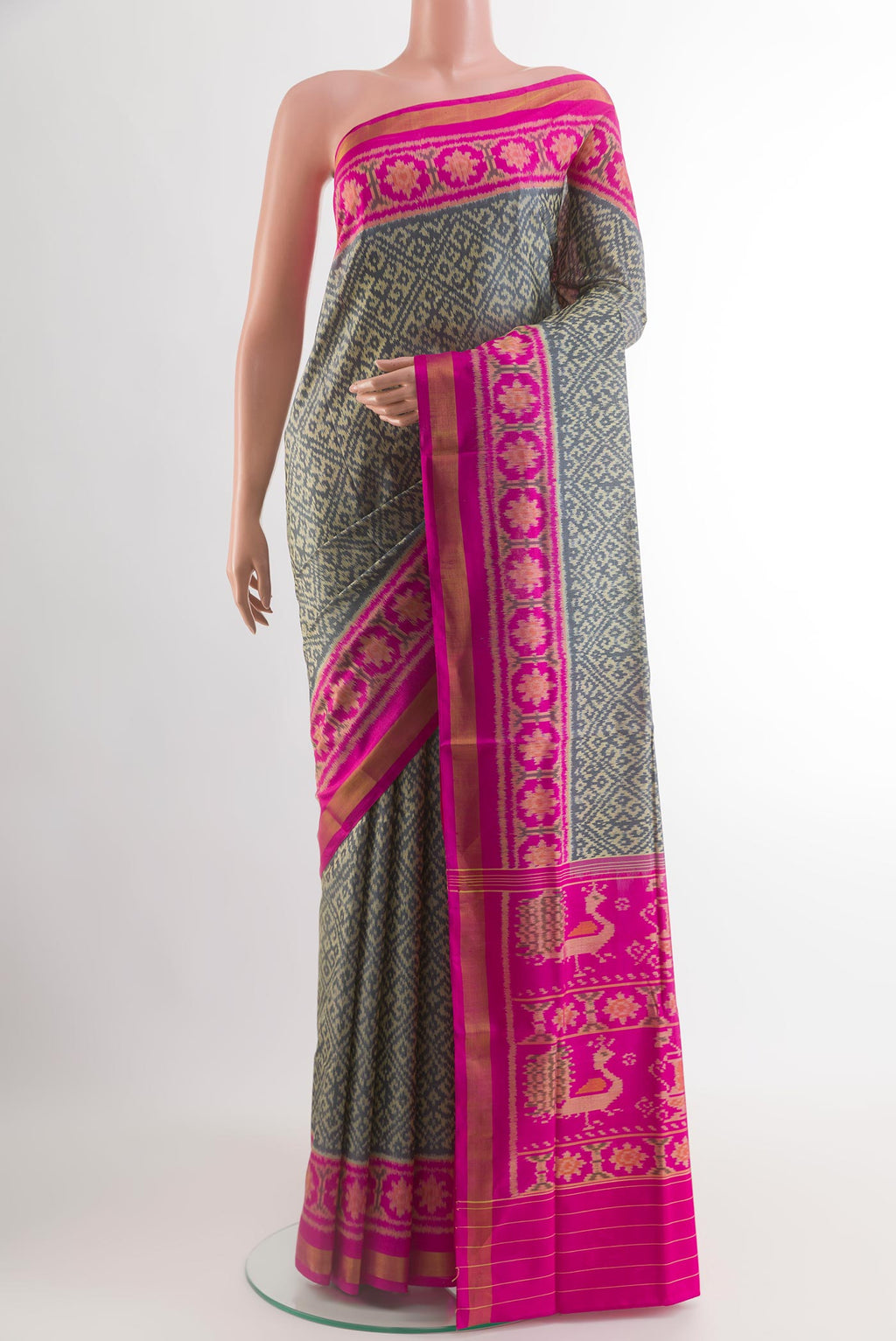 Grey Rajkot Patola Silk Saree with Pure Ikat on the body and Ikat Border.  displayed on a mannequin