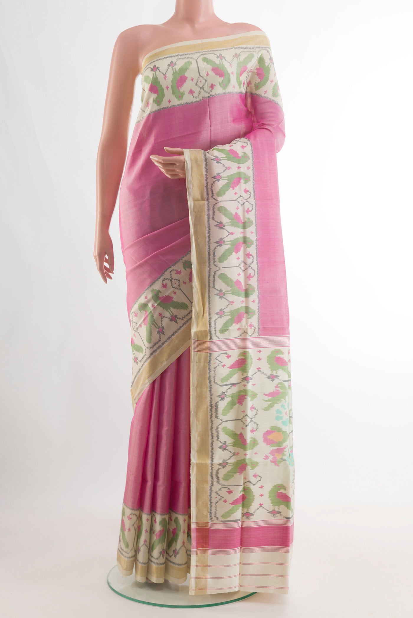 Pink Rajkot Patola Silk Saree with Plain Body and Ikat Border.  displayed on a mannequin