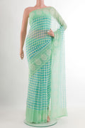Green Chiffon Saree with Checked design on the body and Embroidery Border.  displayed on a mannequin