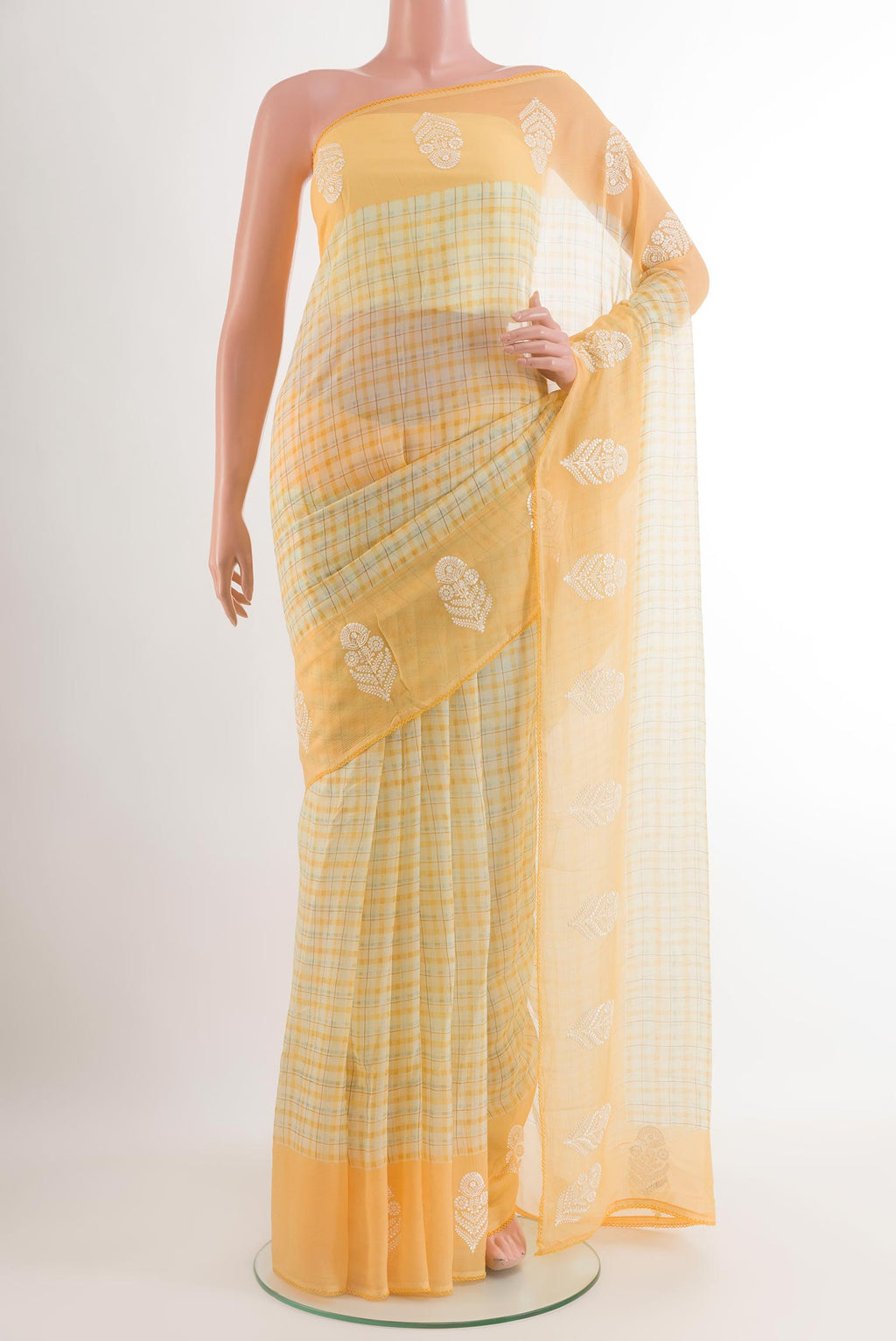Yellow Chiffon Saree with Checked design on the body and Embroidery Border.  displayed on a mannequin