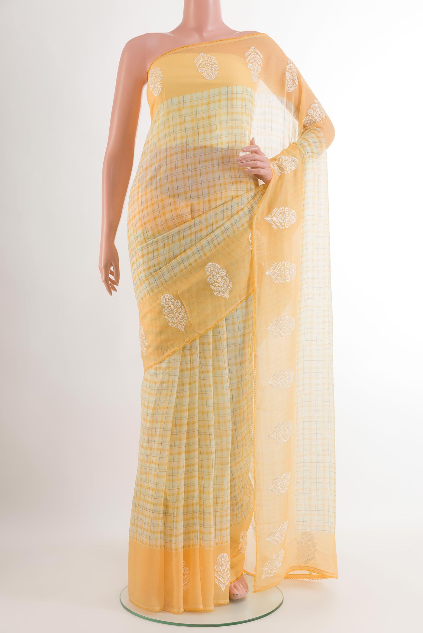 Yellow Chiffon Saree with Checked design on the body and Embroidery Border.  displayed on a mannequin
