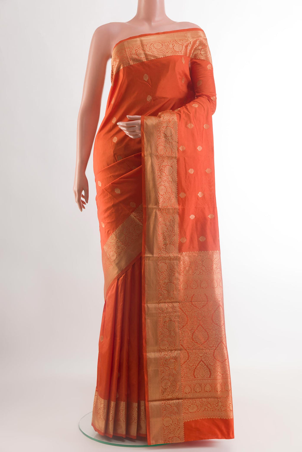 Orange Bangalore Silk Saree with Zari Butta on the body and Zari Border.  displayed on a mannequin