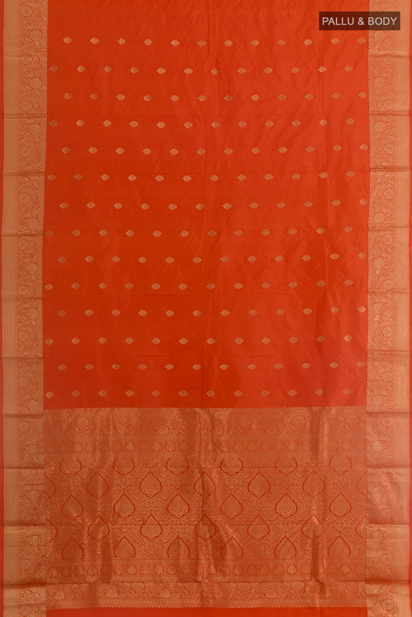 Flat view of Orange Bangalore Silk Saree with Zari Butta on the body and Zari Border. 
