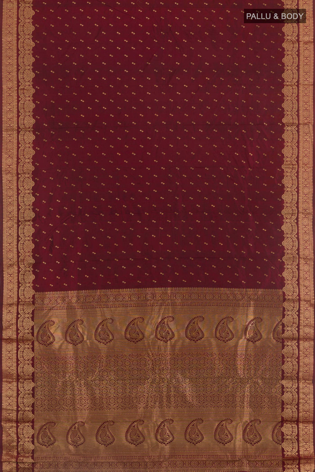 Flat view of Maroon Kanjivaram Silk Saree with Zari Butta on the body and Zari Border. 