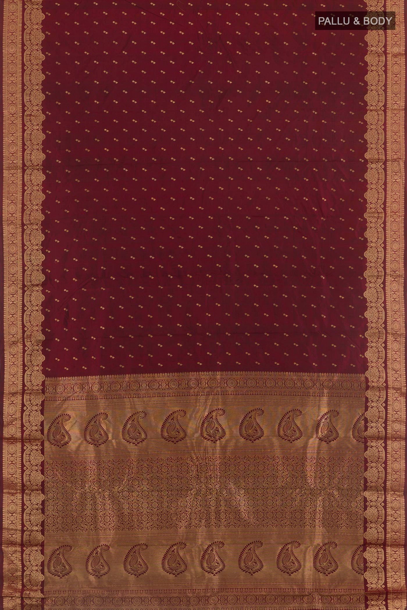 Flat view of Maroon Kanjivaram Silk Saree with Zari Butta on the body and Zari Border. 