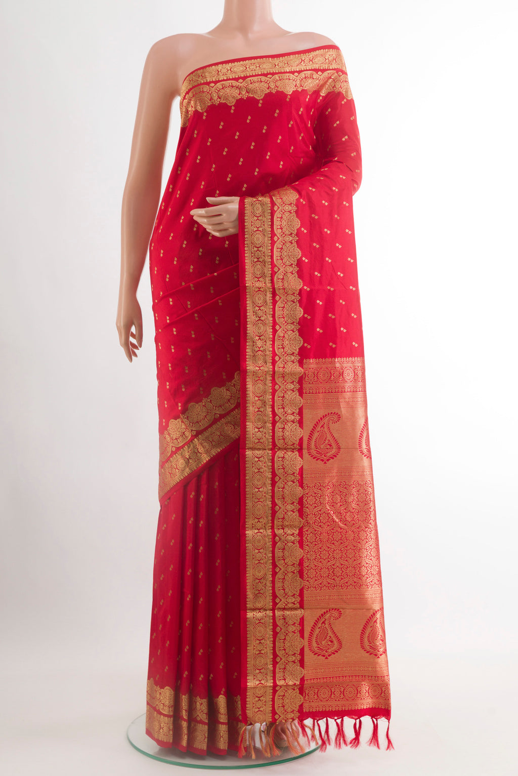 Red Kanjivaram Silk Saree with Zari Butta on the body and Zari Border.  displayed on a mannequin