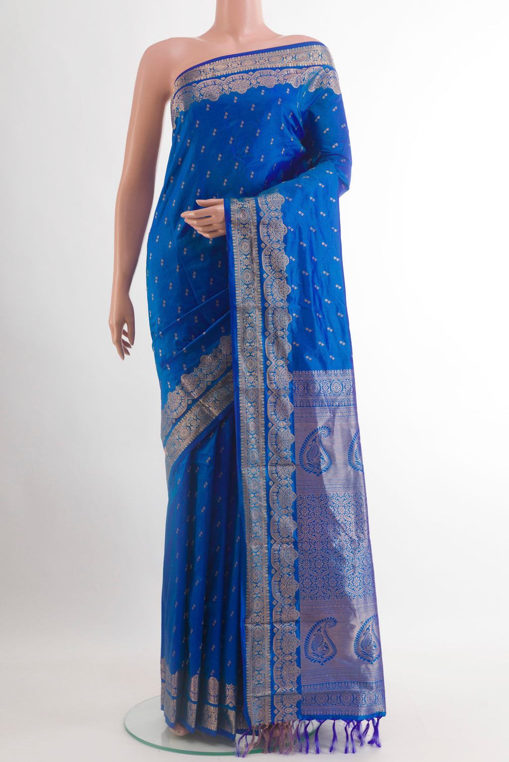Royal Blue Kanjivaram Silk Saree with Zari Butta on the body and Zari Border.  displayed on a mannequin