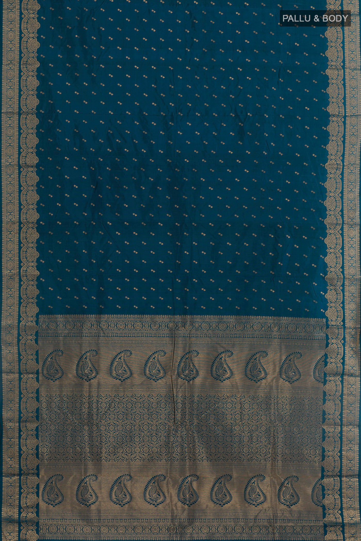 Flat view of Peacock Blue Kanjivaram Silk Saree with Zari Butta on the body and Zari Border. 